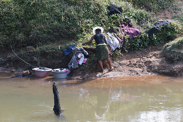 Madagascar - lady doing the wash in the river
